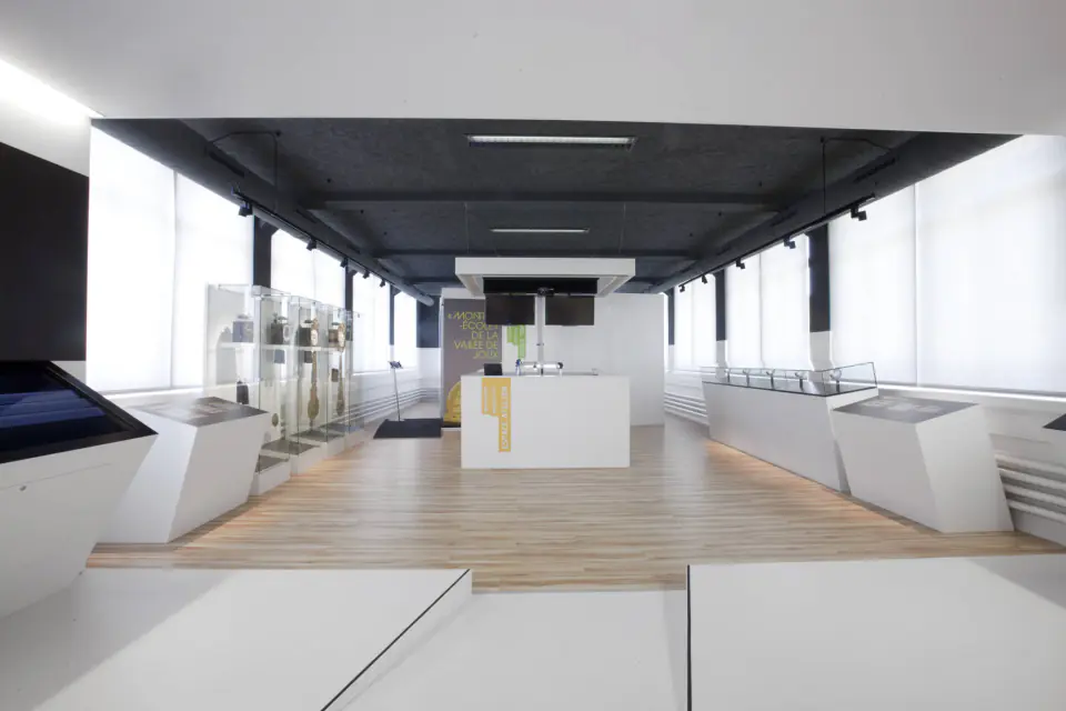 Long white room and display cases
