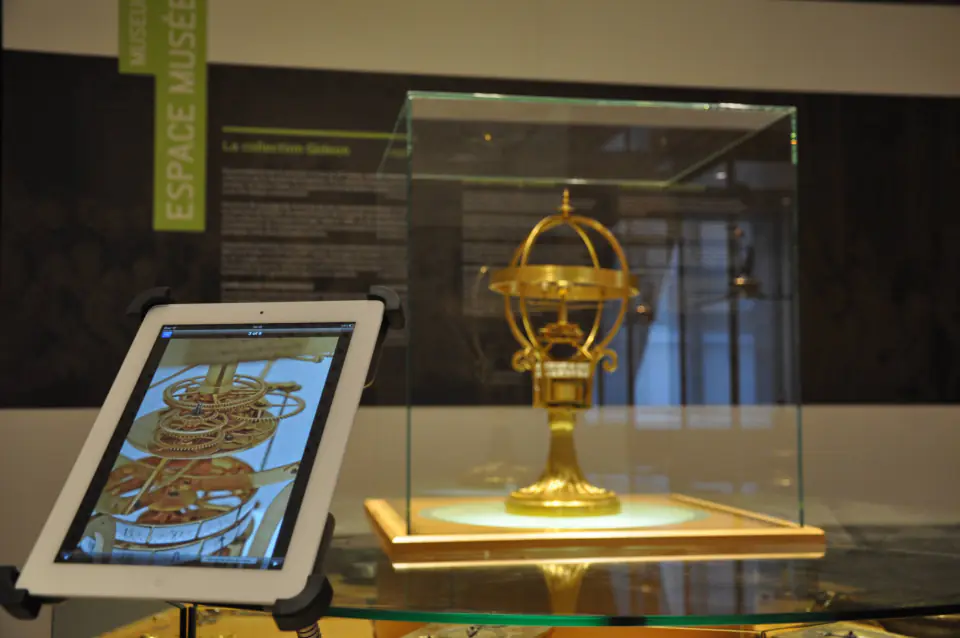 Golden armillary sphere and explanatory plaque