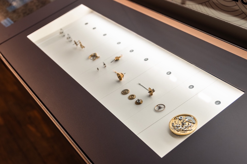 A display case showcasing clockwork mechanisms